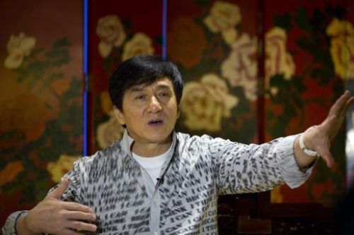 Action star Jackie Chan speaks during an interview in Beijing, Monday, Aug. 3, 2015. Action star Jackie Chan said Monday that he wants to work with his son Jaycee on a movie and an album as they mend their relationship after Jaycee was jailed on a drug charge. (AP Photo/Ng Han Guan)